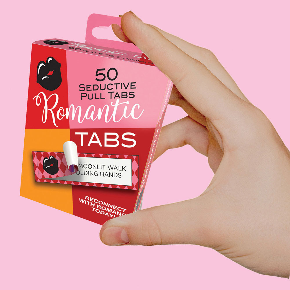 Romantic Tabs box held in one hand, showing the compact packaging