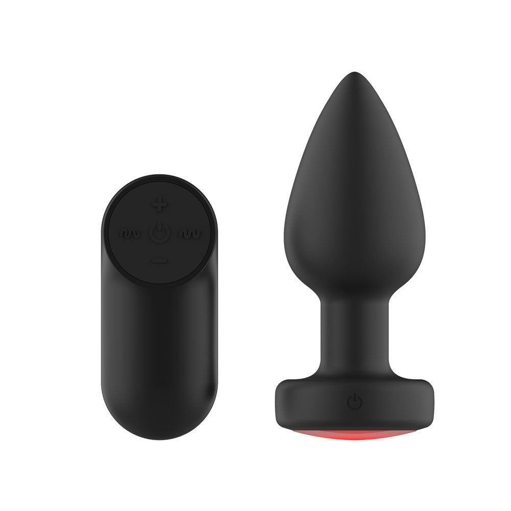 Passion Play medium vibrating butt plug showing the base power button beside its wireless remote